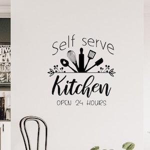 May include: Black and white kitchen wall decal with the text "Self serve kitchen open 24 hours" and a design of kitchen utensils.