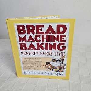 May include: A yellow cookbook titled "BREAD MACHINE BAKING PERFECT EVERY TIME" with red text. The book features recipes for bread and desserts, custom-created for bread machines. The authors are Lora Brody & Millie Apter.