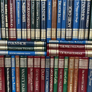 May include: A selection of classic novels, such as "Moby Dick," "Treasure Island," and "Little Women," displayed with their spines visible. The books are arranged in rows, with gold lettering on the spines. The books are in various colours, including red, blue, green, and brown.