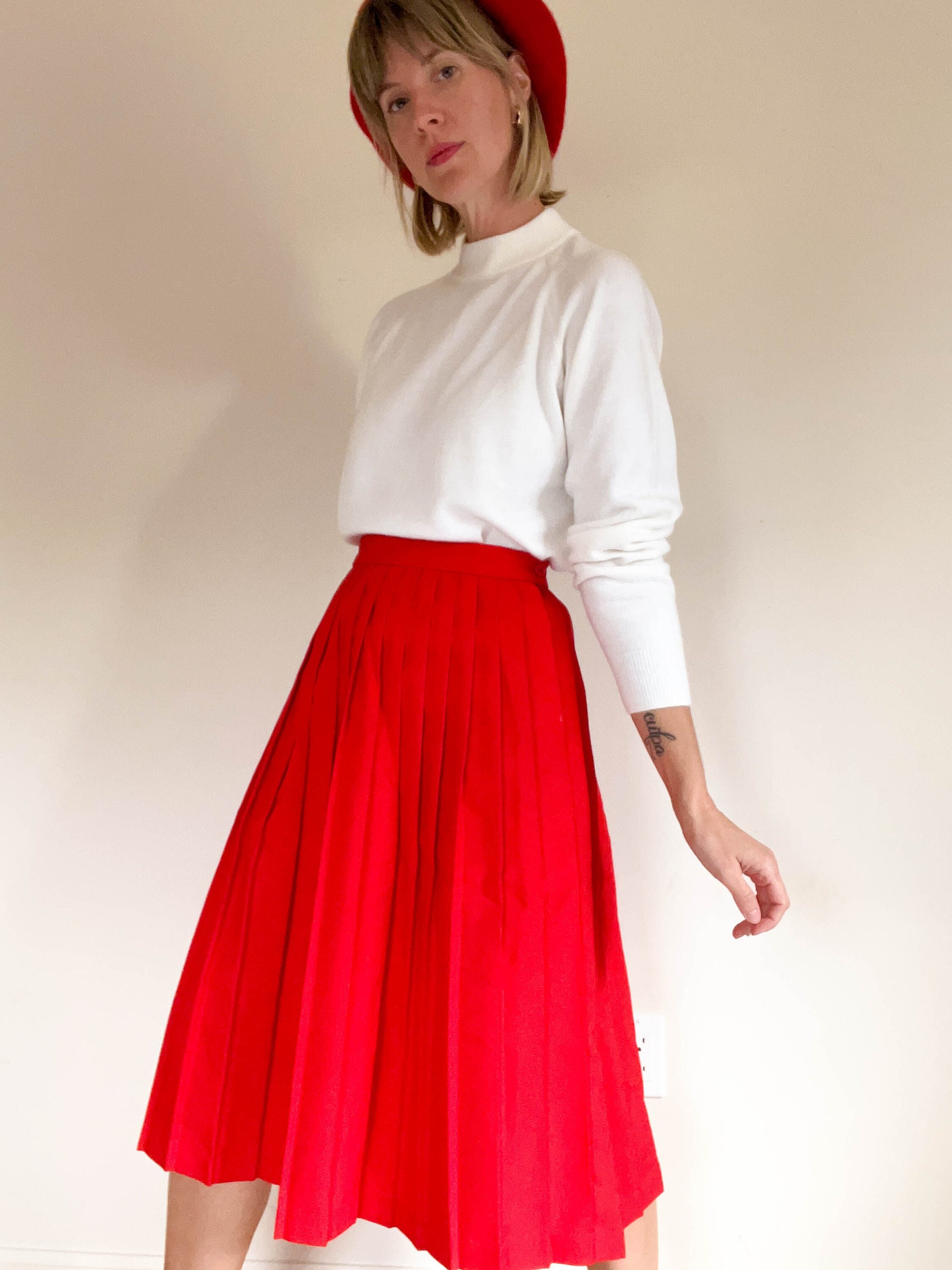 Red accordion pleated skirt top