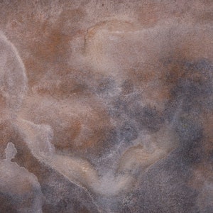 May include: Abstract watercolor painting with a blend of brown, gray, and white hues. The artwork features a textured, cloudy appearance with soft edges and subtle color variations, creating a sense of depth and movement. The overall effect is organic and atmospheric.