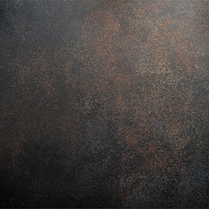 May include: A dark grey textured background with a subtle brown speckled pattern.
