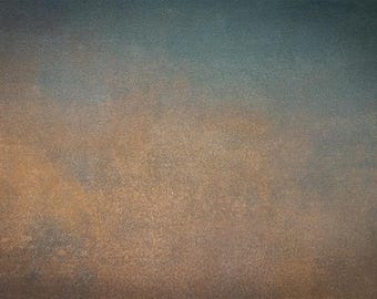 May include: A textured background with a gradient of brown, orange, and blue colours. The background has a subtle, grainy texture.
