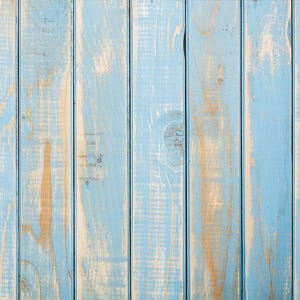 May include: A close-up of a weathered wood surface painted in a light blue colour. The wood planks are arranged vertically and have a rustic, distressed look.