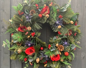 Mixed spruce Christmas wreath, large with red roses, thistles, frost red berries, poppy seeds, eucalyptus, pine cones