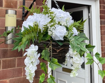 White round artificial hanging basket, with hydrangeas, roses, wisteria, fern and gypsophila. Summer baskets