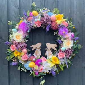 Easter / spring wreath for your front door, with daffodils, Easter eggs, roses, hydrangeas