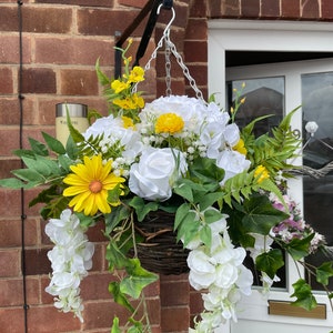 White round artificial hanging basket, with hydrangeas, roses, wisteria, fern and gypsophila. Summer baskets Yellow