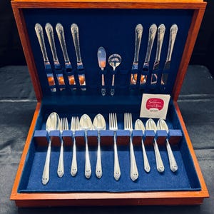 48pc Silverplated Flatware Set, Lovely Lady pattern by Holmes and Edwards. It was made under the International Silver brand.