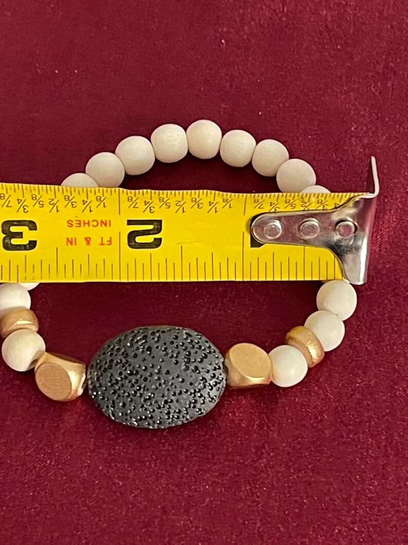 Black Lava And White Dyed Wood Beads Scent Bracelet with a Small Sample of D\u014dTERRA Lavender Essential Oil 8-9mm beads