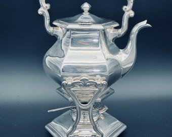 Silverplated Tilting Water Pot by Gorham.