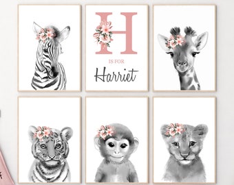 May include: Six framed art prints featuring black and white animal portraits with floral crowns. Includes a zebra, giraffe, tiger, monkey, and lion cub. One print displays the letter "H" with the name "Harriet".