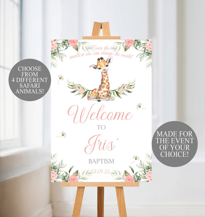 May include: A white welcome sign on a wooden easel, featuring a watercolor giraffe illustration. The sign includes text that reads "Welcome to Iris Baptism" and "Even the smallest one can change the world." Decorative floral elements and bees surround the text.