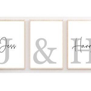 May include: Three framed prints with the names "Jess" and "Harry" in cursive script, with a large ampersand symbol between them. The names and ampersand are in grey.
