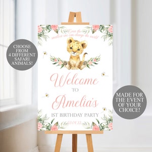 May include: A welcome sign for a 1st birthday party, featuring a watercolor illustration of a lion cub, flowers, and bees. The sign includes the text "Welcome to Amelia's 1st Birthday Party" and "Even the smallest one can change the world."