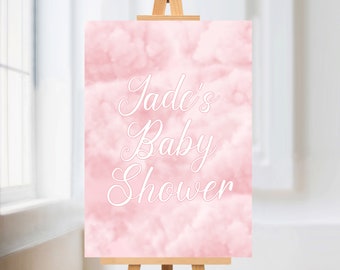 May include: Pink baby shower sign with white clouds and the text "Jade's Baby Shower" in a cursive font.