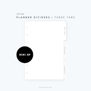 May include: A white planner divider set with three tabs labeled "Self Love", "Trackers", and "Finances". The divider set is designed for a mini Happy Planner and features a black circle with the text "MINI HP" in white.
