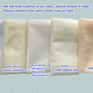 May include: Five swatches of tulle fabric in different shades of white and ivory. The swatches are labelled with their colour names and descriptions, including "Cold White with blue hue", "Dark Ivory Obvious yellow hue", "Pure White Off White Milk White No yellow hue", "Ivory Little yellow hue", and "champagne".
