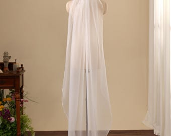 May include: A long, sheer white bridal veil made of lightweight fabric, draped over a mannequin. The veil features a simple, clean-cut edge and falls in soft, vertical folds, extending down the back of the mannequin to create a flowing silhouette.