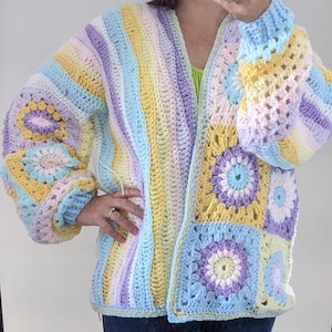 May include: A pastel rainbow striped crochet cardigan with a granny square pattern on the sleeves and back. The cardigan has a V-neck and is open front.