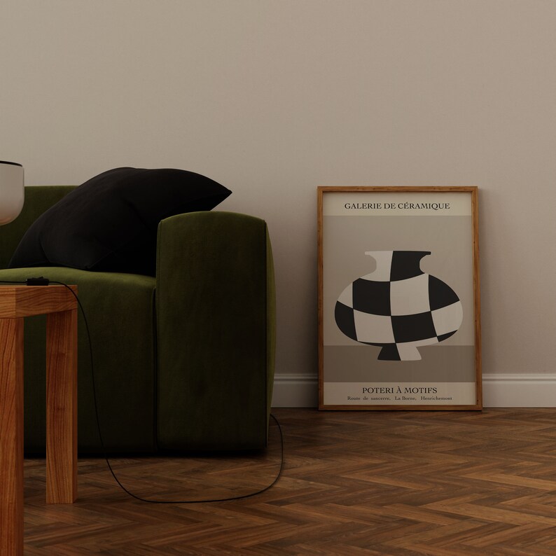 May include: A framed poster with a black and white checkered vase illustration. The poster is titled "GALERIE DE C&Eacute;RAMIQUE" and "POTTERIE &Agrave; MOTIFS".