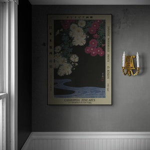 May include: A vintage Japanese woodblock print of chrysanthemums in shades of pink and white, with a blue stream flowing through the center. The print is titled "Japanese Woodblock Prints O. Koson (1877-1945)" and is from the gallery "Cassipoeia Fine Arts 215 Thompson St New York."
