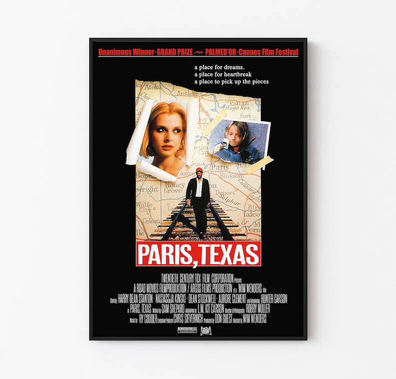 May include: A black movie poster for "Paris, Texas" featuring a collage of images. The poster includes a woman's portrait, a child's photo, and a man standing on train tracks. The title "PARIS, TEXAS" is prominently displayed.