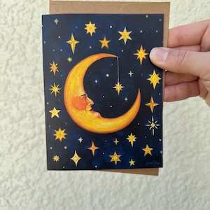 Homme céleste fantaisiste dans la carte de voeux de la lune. Carte d'art vierge pliée « Observateur des étoiles ».