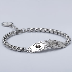 May include: Silver medical ID bracelet with a chain link design. The bracelet has a decorative tag with an engraved medical symbol and the text "Jean D. Winstead/1964 Type 2 Diabetes ICE: 832.877.510X".