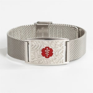 May include: A silver medical alert bracelet with a mesh band and a rectangular tag. The tag has a floral design and a red medical symbol with a snake and staff.