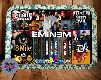 May include: A rectangular rolling tray featuring a collage of Eminem album covers, the Shady Records logo, and the text 8 Mile, Encore, Relapse, Recovery, Revival, Kamikaze, and Bad Meets Evil, framed by a decorative green and white floral border.