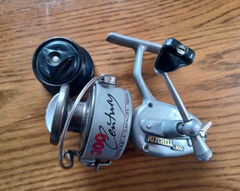 A Stunning Vintage  Mitchell 300 Fifty Years Anniversary Edition Fishing Reel With Silver Finish and Decals - Mint Condition