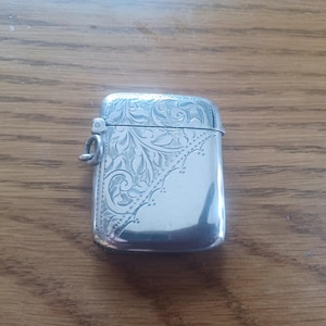 May include: A handmade wooden sign with the text "Welcome" in a playful font. The sign features a distressed white background and a dark stained wooden frame. Dimensions are approximately 12 inches wide and 6 inches tall.