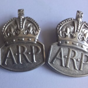 Two Sterling Silver ARP Lapel Badges
