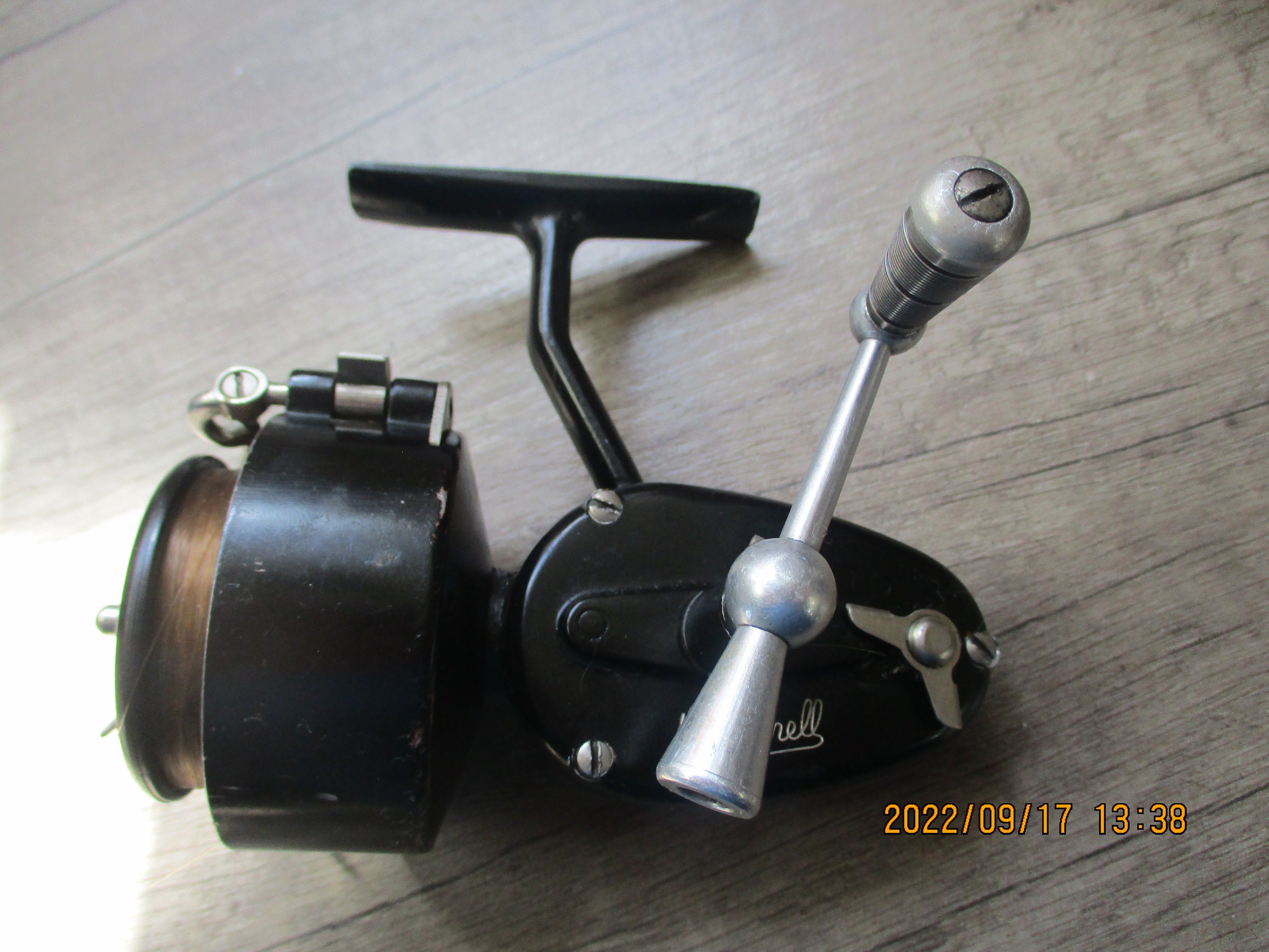 A Vintage Early Half Bale Arm Mitchell Spinning Reel (300 Shape)