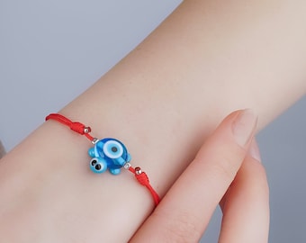 Akupara -Murano glass blue turtle bracelet, evil eye jewelry, red string turtle bracelet, adjustable red cord, protection patience endurance