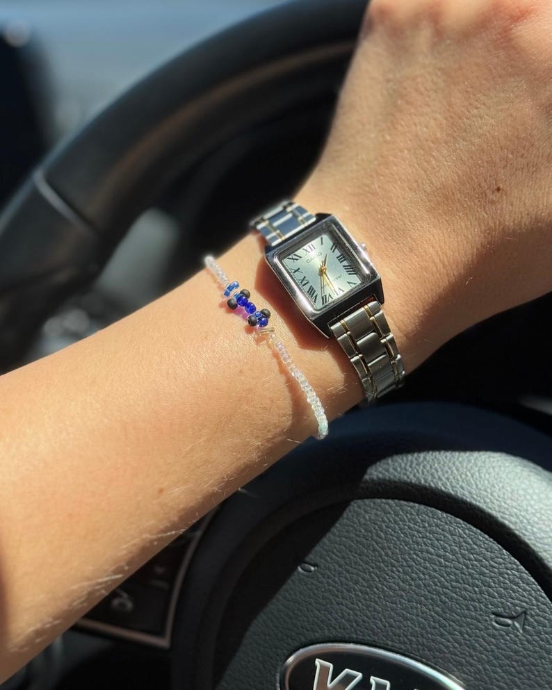 Handmade bracelet featuring blue and white beads, representing the classic Williams Racing Formula 1 team colors; ideal for fans of Williams F1 heritage.