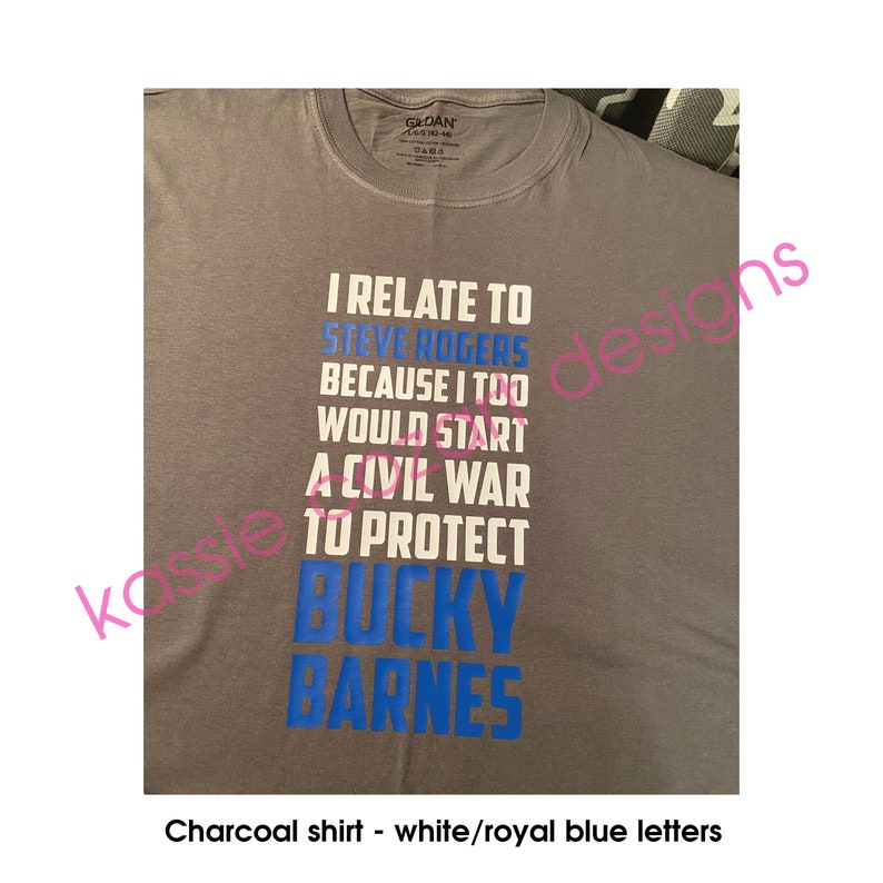 May include: A charcoal gray t-shirt with white and royal blue lettering. The text reads "I relate to Steve Rogers because I too would start a civil war to protect Bucky Barnes".