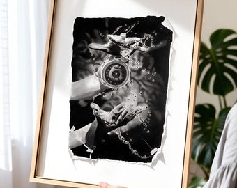 May include: A framed black and white art print featuring a high-contrast illustration of two hands cupped together, releasing a circular object surrounded by splashing water droplets, set against a dark, textured background with torn paper edges.