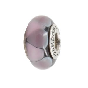 May include: A glass bead with a heart design in shades of lavender and white. The bead has a silver-colored metal ring with the word "Pandora" engraved on it. The bead is a charm for a bracelet or necklace.