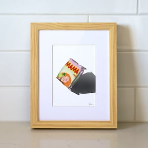May include: A framed illustration of a pink and orange instant noodle packet with the text "MAMA" on it. The packet is floating in the air with a shadow below it.