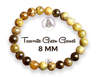 May include: A green gemstone bracelet made of 8 mm tsavorite green garnet beads. The bracelet is made of natural stones and has a polished finish.