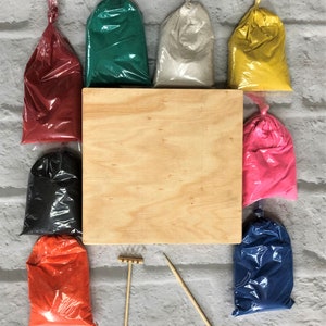 May include: A set of colored sand for creating sand art, with a wooden tray, rake, and two wooden sticks. The sand comes in red, green, white, yellow, pink, black, orange, and blue.