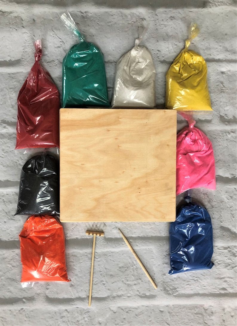 May include: A set of colored sand for creating sand art, with a wooden tray, rake, and two wooden sticks. The sand comes in red, green, white, yellow, pink, black, orange, and blue.