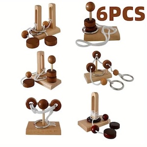 May include: Six wooden brain teaser puzzles with various designs. Each puzzle features wooden components, including spheres, cylinders, and rings, connected by string or rope. The puzzles are displayed on small wooden bases.