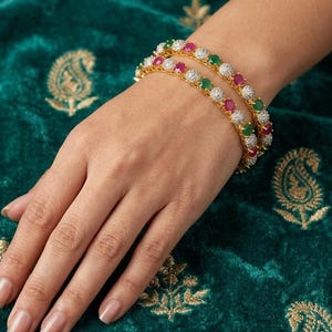 May include: A white ceramic mug with a black handle and the text "But First, Coffee" in a handwritten style. The mug is on a white surface. The mug is approximately 4 inches tall.