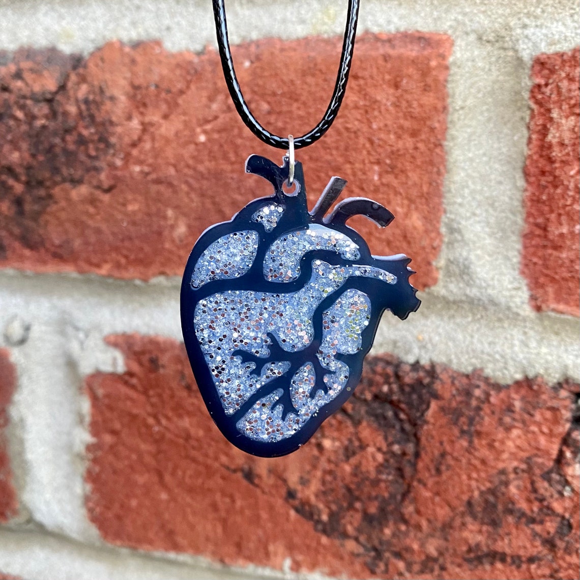 Silver sparkle human heart pendant necklace Etsy