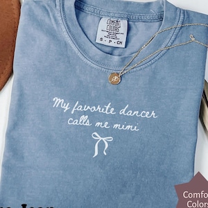 May include: A set of three ceramic mugs with a speckled, matte finish. The mugs are in shades of cream, light gray, and dark gray. Each mug has a simple, minimalist design, perfect for coffee or tea.