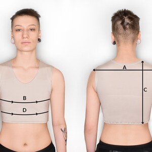 May include: A beige sleeveless top with measurements marked on it. The measurements are labeled A, B, C, and D. The top is being worn by a person with short hair.