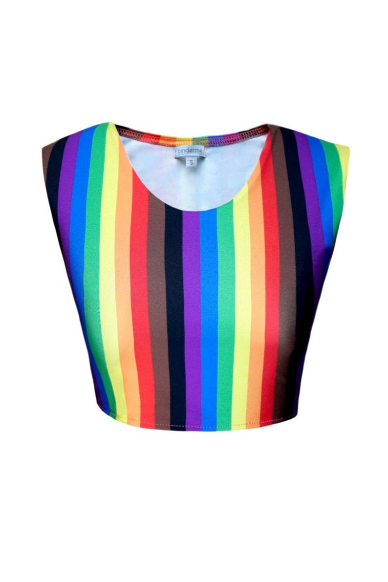 May include: A rainbow striped sleeveless crop top with a round neckline. The top has a small white tag with the word "binderme" on it.